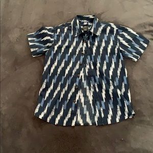 A blue button up dress shirt